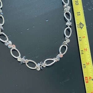 Elegant Silver Necklace with Dangling Accents